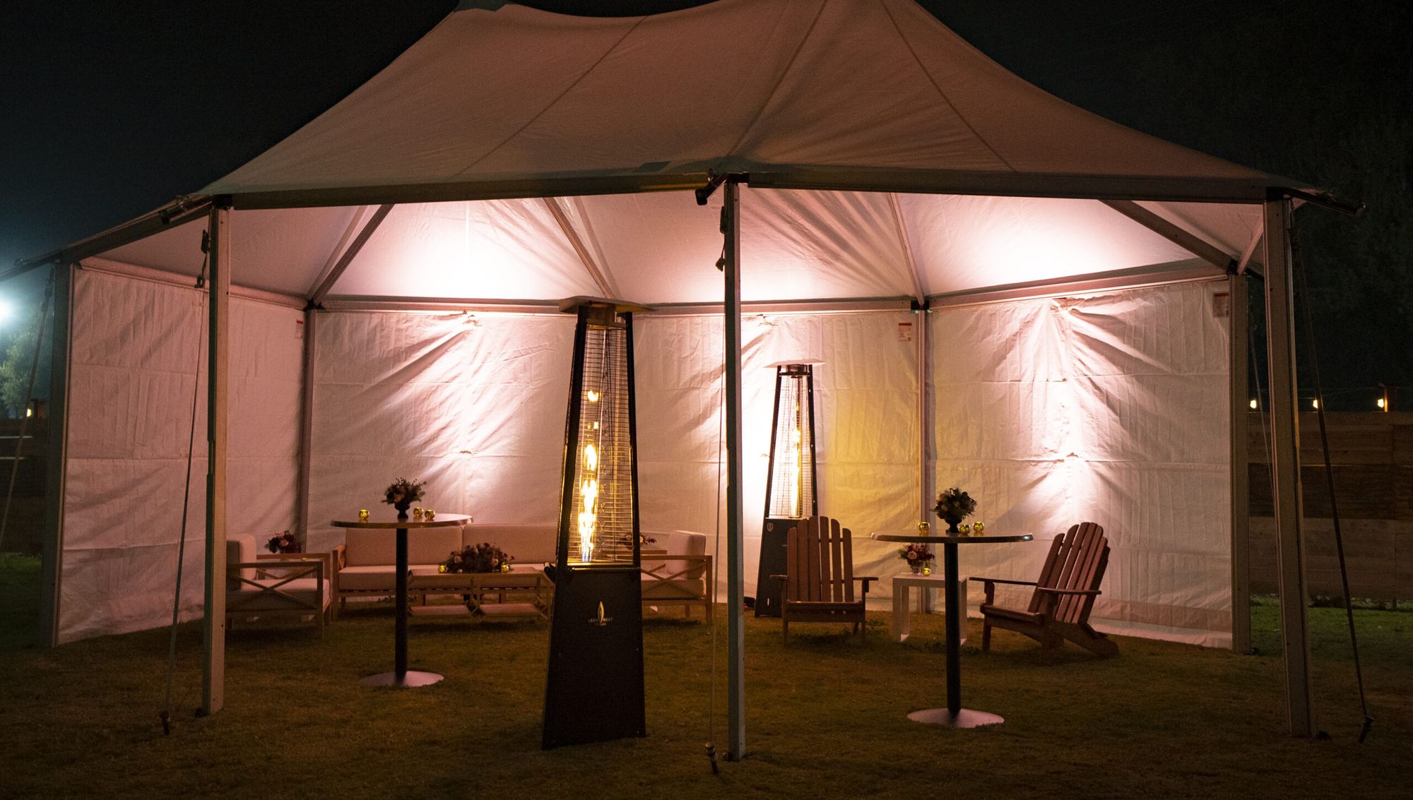 The Lawn with lounge tents at night at The Silos
